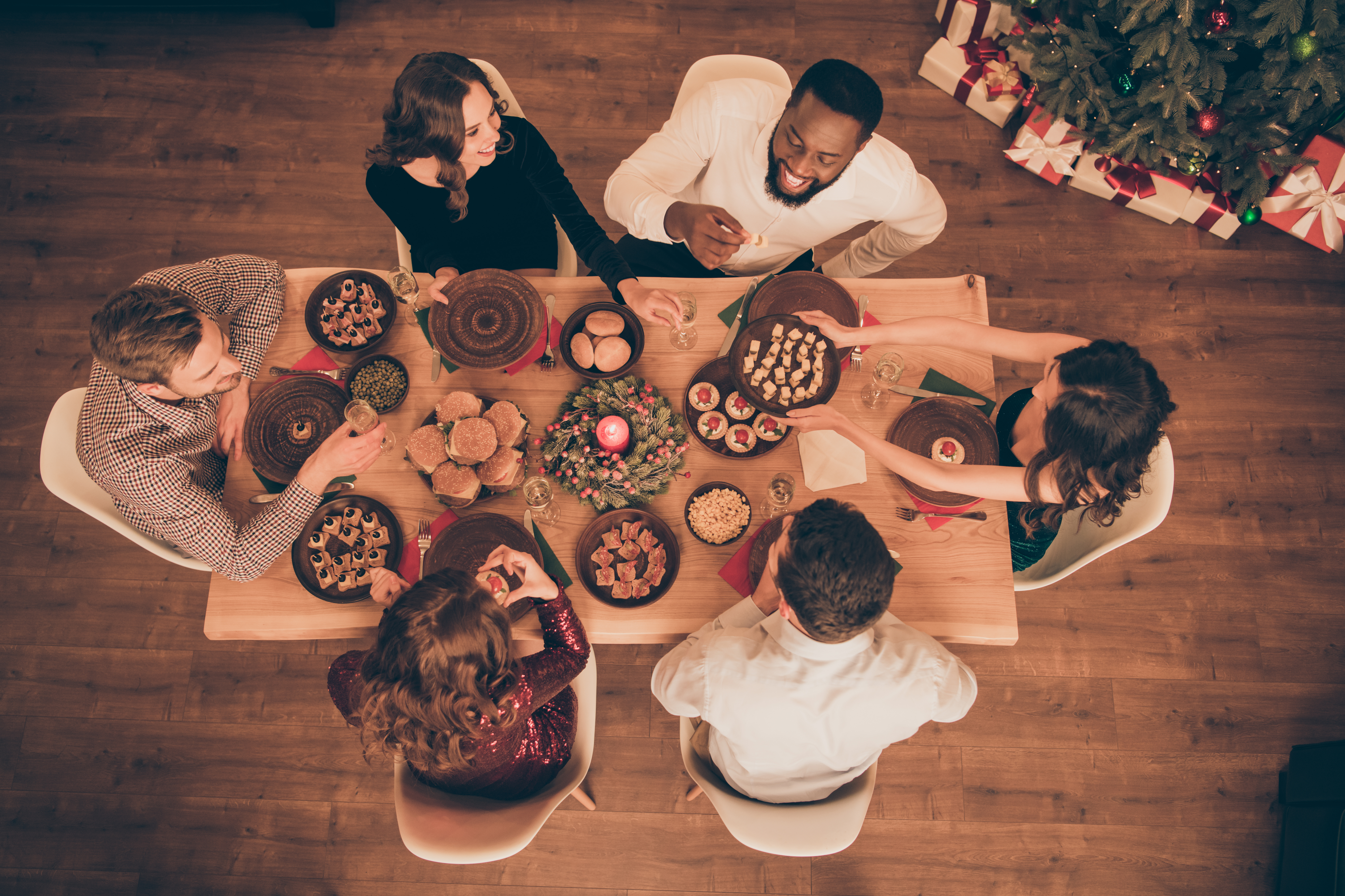 Top above high angle view of friends sharing holiday meal